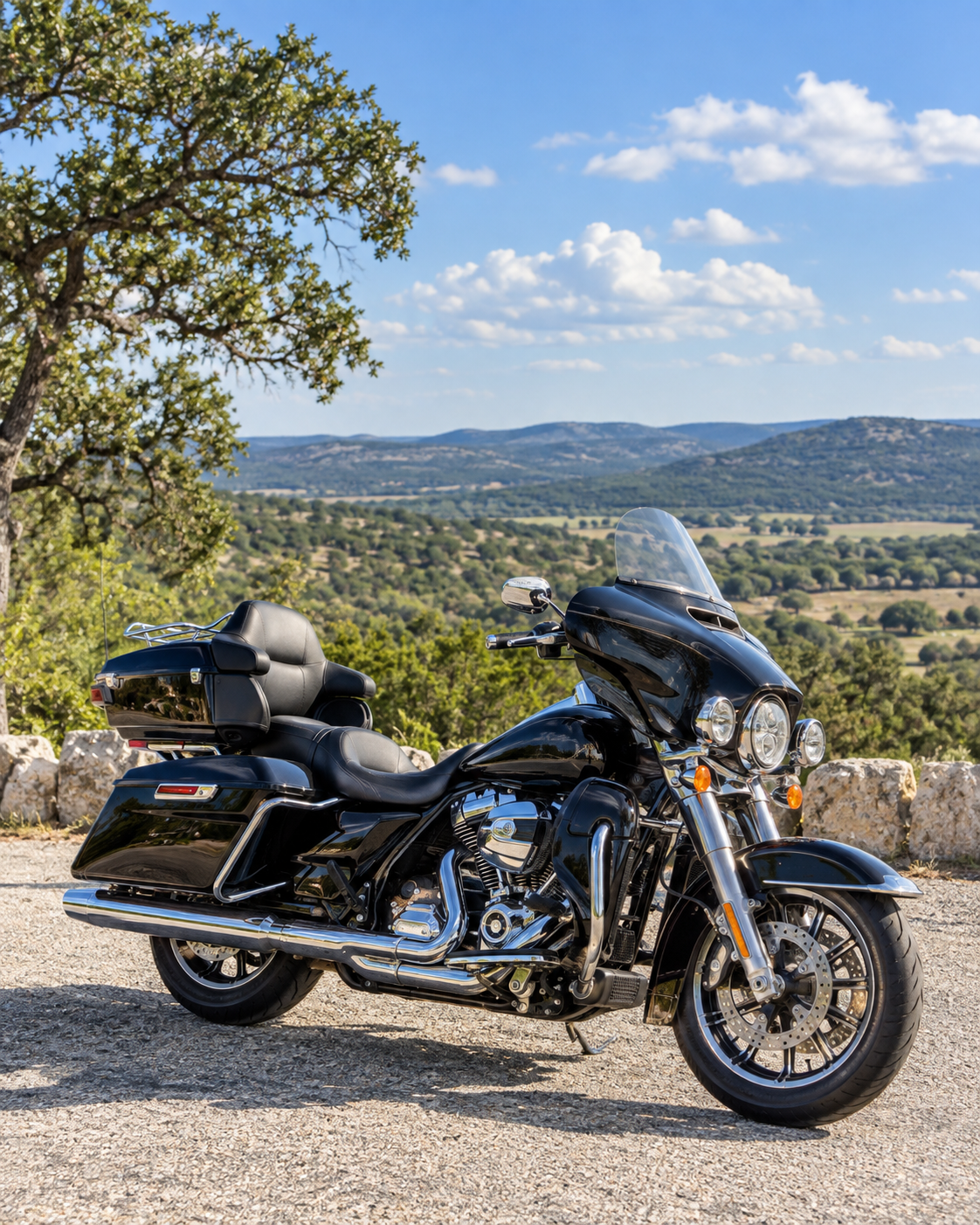 Touring motorcycle parked safely at a scenic stop overlooking the Texas Hill Country
