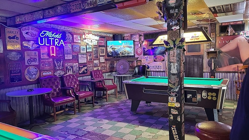 Pool tables, neon signs and motorcycle memorabilia inside Murphy’s on Main in La Marque